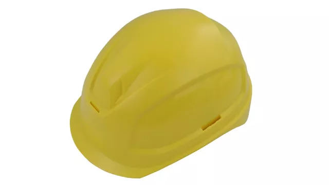 A captivating image displays a striking yellow construction helmet, its flat surface and contrasting white background drawing attention. The well-maintained, rounded front and pointed back highlight its durability, making it a visually appealing symbol of functionality.