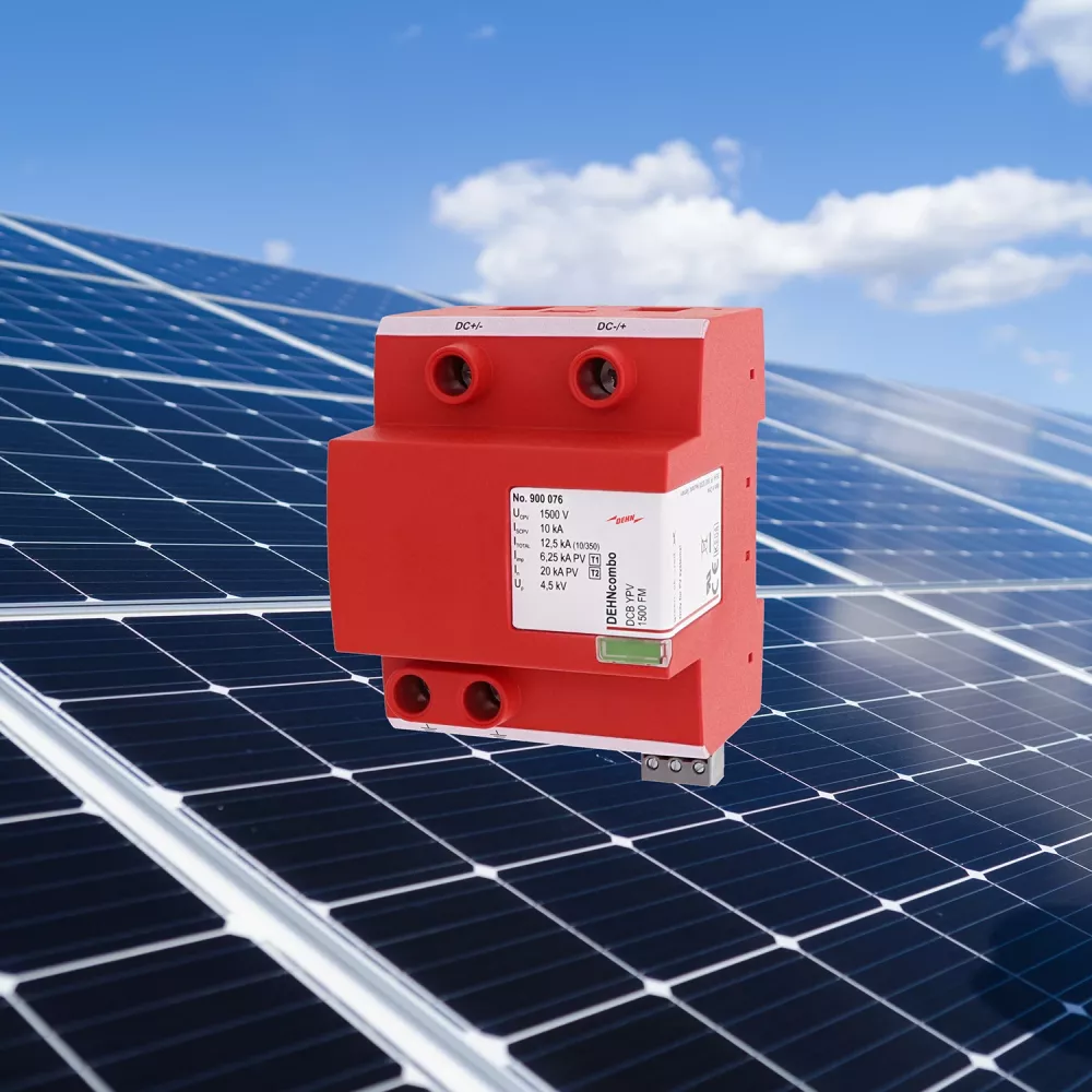 Red DEHN surge protector shown in front of solar panels under a blue sky.