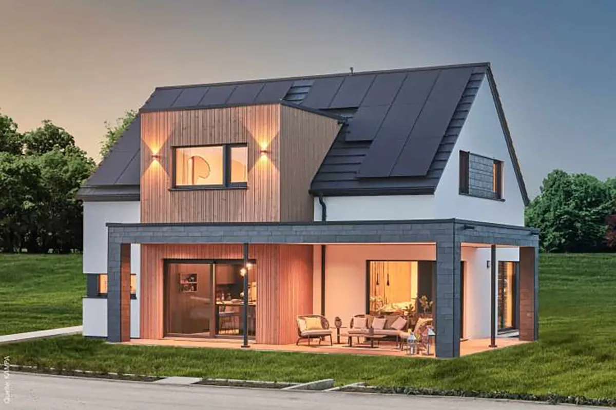 Single-family house with indirect lighting and a lot of plants in the garden at dusk